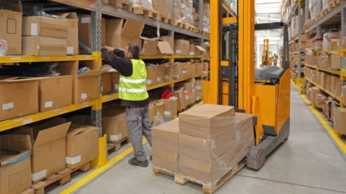 warehouse worker busy with packages
