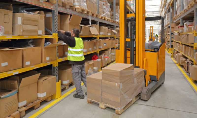 warehouse worker busy with packages